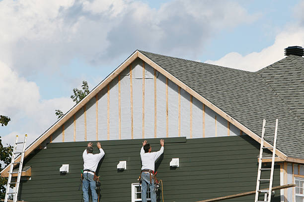 Professional Siding Installation technician working in Adamsburg, PA